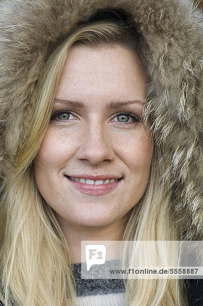Close up of woman wearing fur hat