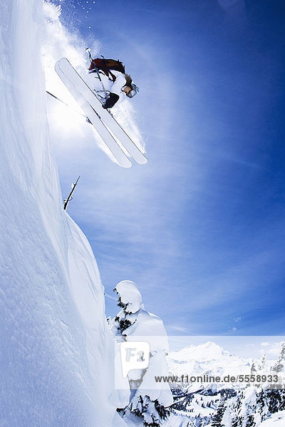 Skier jumping on snowy slope