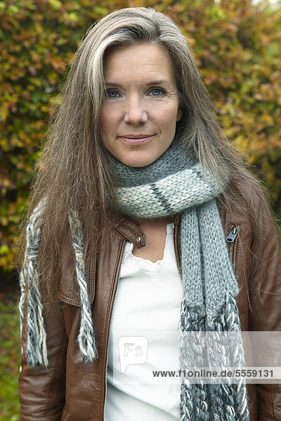 Older woman wearing scarf outdoors