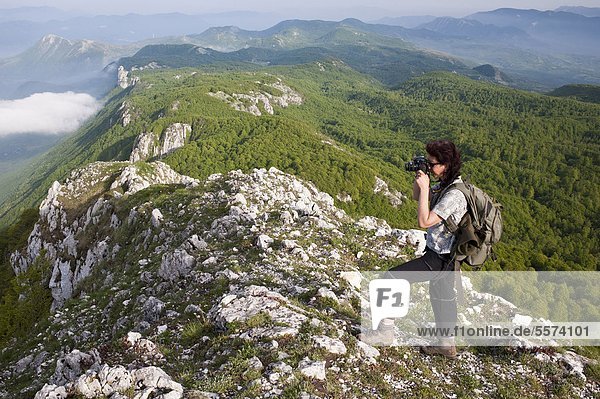Italy  Campania  Cilento National Park  Alburno Mountains  Hiker Photographing                                                                                                                          