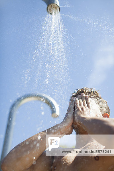 Man showering outdoors