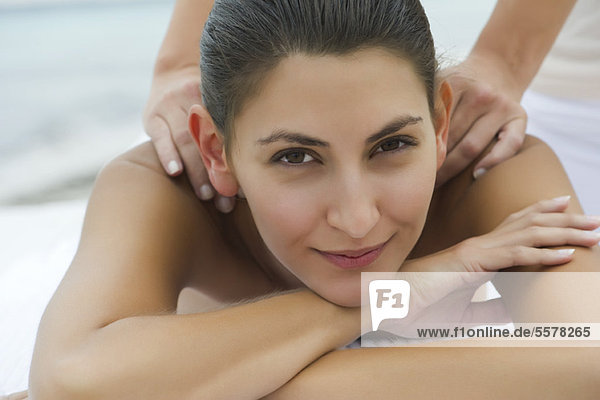 Young woman enjoying massage  portrait