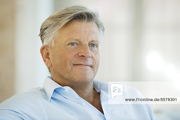 Senior man looking away in thought  portrait