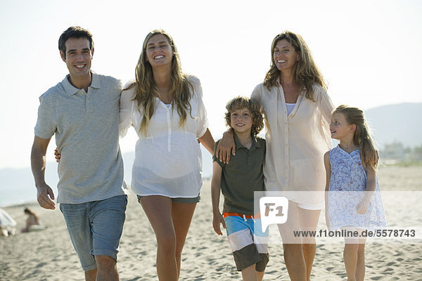 Family walking together at the beach