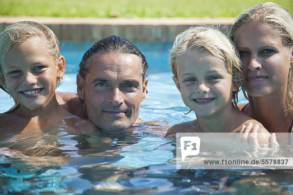 Family in swimming pool  portrait