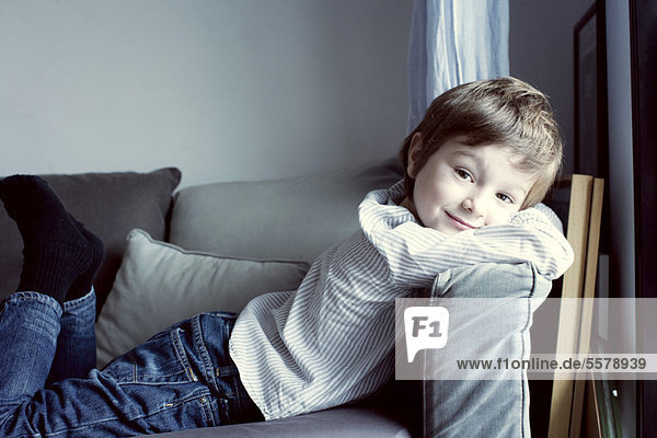Boy relaxing on sofa  portrait
