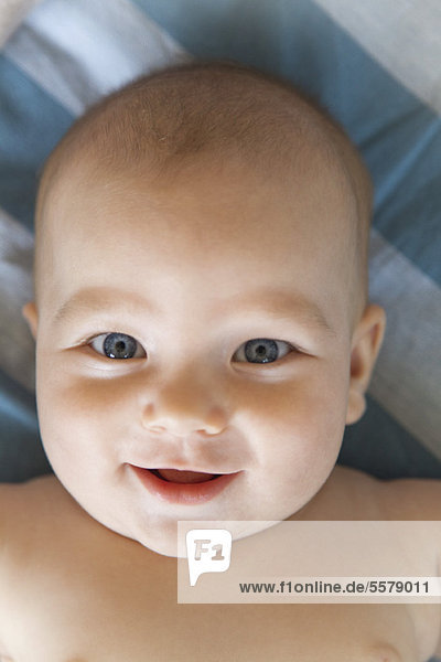 Baby smiling at camera  portrait