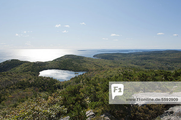 Forest and sea views from the summit of Champlain Mountain  328 m  over The Bowl lake  hiking trail  Bear Brook Trail  Acadia National Park  Maine  New England  USA  North America