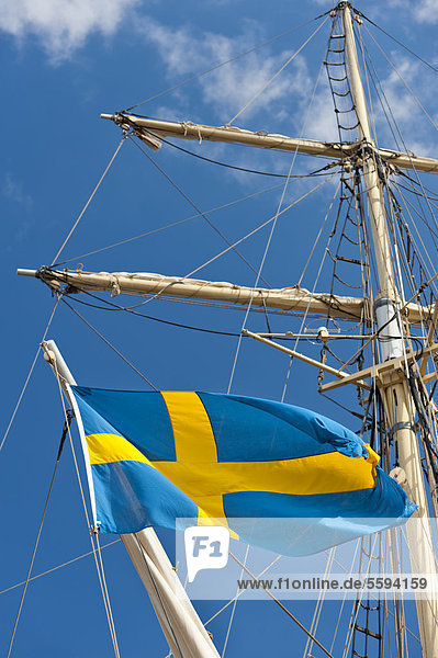 Sweden  Simrishamn  Swedish flag on old sailing boat