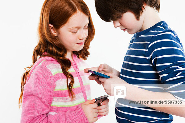 Children looking a smartphones