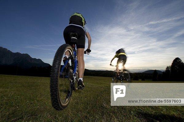 Two mountainbikers in the Dolomites  South Tyrol  Italy