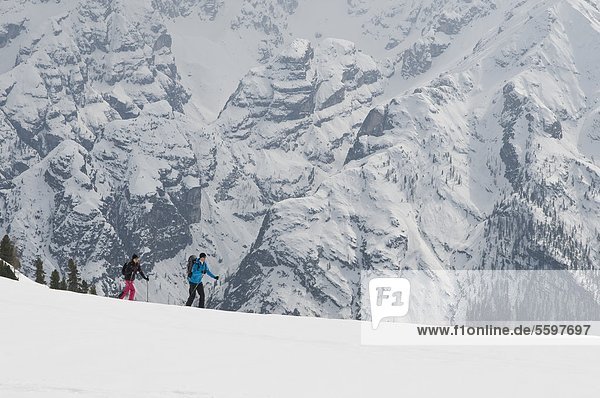 Two ski mountaineers in the Dolomites in winter  Italy