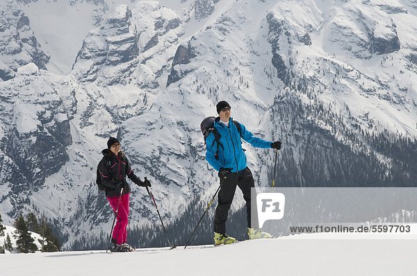 Two ski mountaineers in the Dolomites in winter  Italy