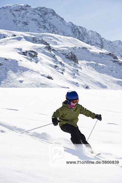 Children skiing on snowy mountainside