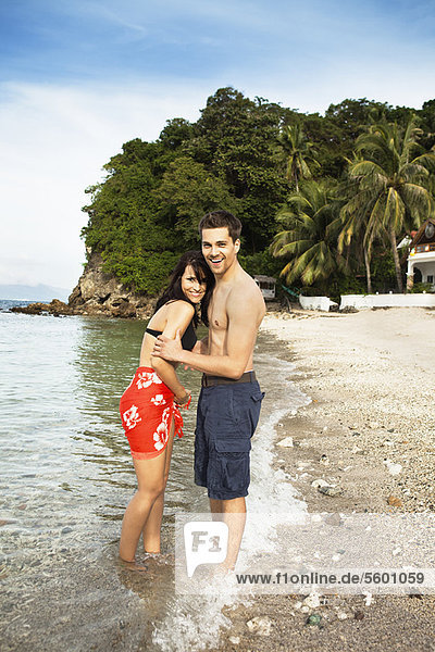 Couple hugging on tropical beach