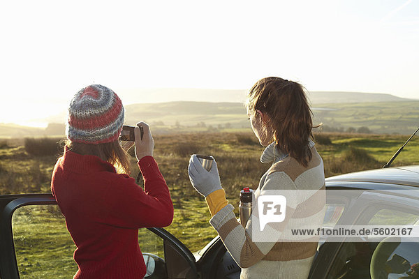 Women admiring landscape from car