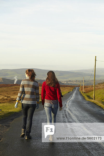 Women walking on rural road