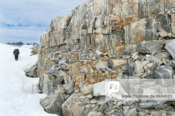 Coloured stones  hikers at Mittivakkat Glacier  Ammassalik Peninsula  East Greenland  Greenland