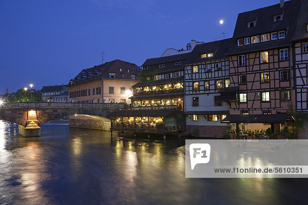 View of the historic town with timber-framed buildings  bridge and canal at night  Strasbourg  Alsace  France  Europe