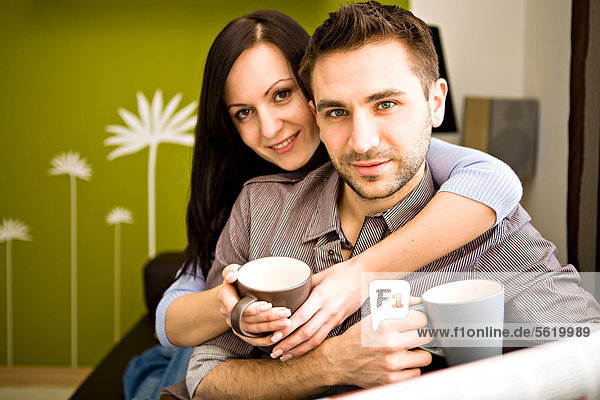 Happy young couple at home