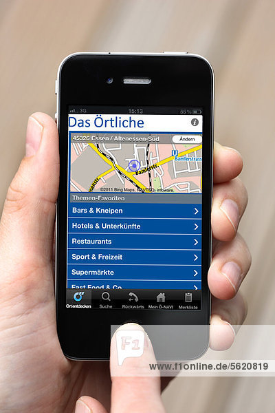 IPhone  smartphone  showing Das Oertliche  a German telephone book app on the display