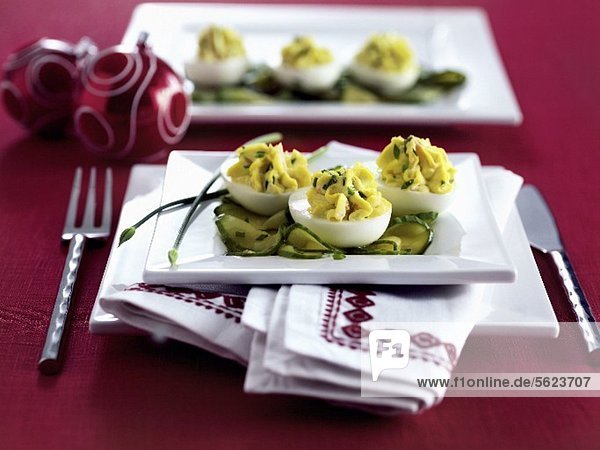 Devilled eggs on cucumber slices