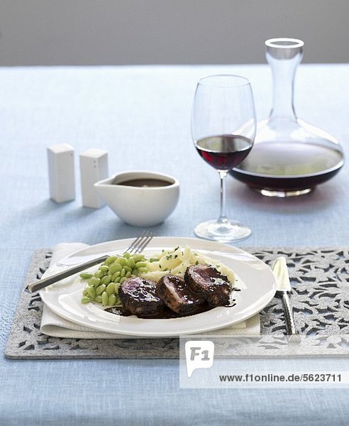 Lamb shoulder with chocolate sauce  mashed potatoes and lima beans