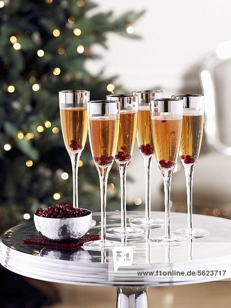 Rose champagne with pomegranate seeds