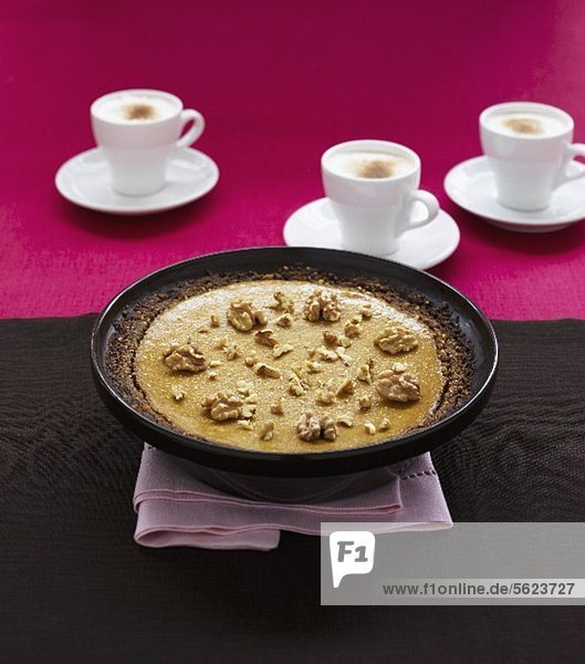 Sweet potato-cheese cake and three cups of cappuccino
