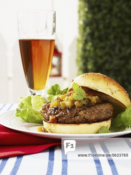 Curried lamb burger with mango chutney and beer