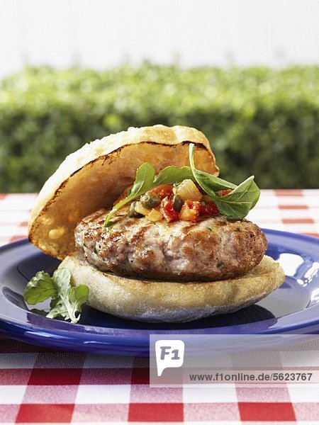Mediterranean burger with tomato caper relish