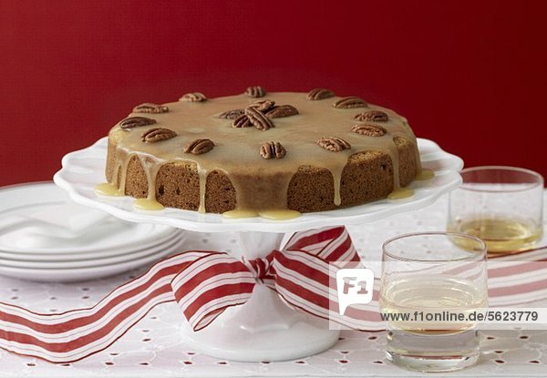 Banana pecan cake on a cake stand