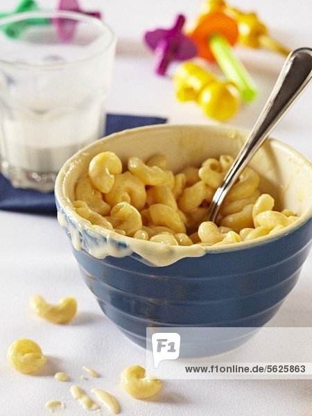 Bowl of Macaroni and Cheese for a Child  Partially Eaten Glass of Milk