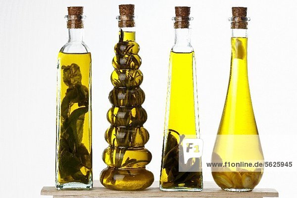 Bottles of olive oil with various aromas