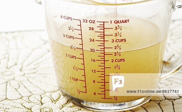 2 1/2 Cups of Chicken Broth in a Measuring Cup