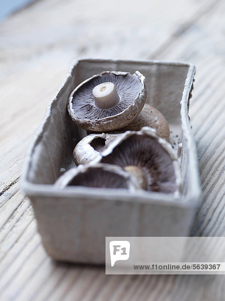 Punnet of button mushrooms