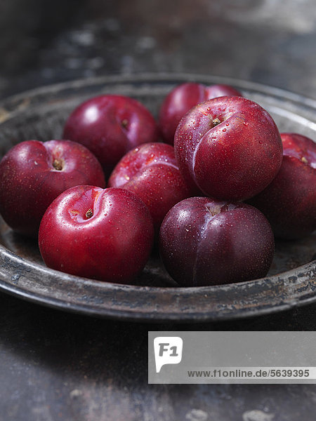 Close up of bowl of plums