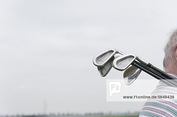 Germany  North Rhine Westphalia  Duesseldorf  Golfer with golf club