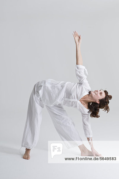 Mid adult woman doing exercise  smiling