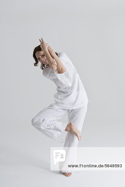 Mid adult woman doing exercise
