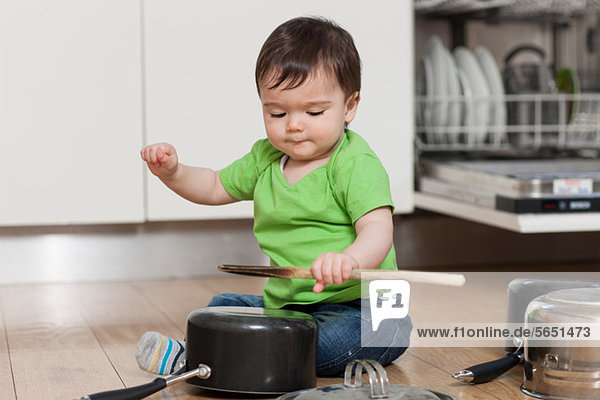 Baby playing with pots and pans