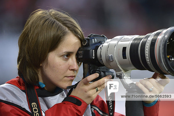 Press photographer  concentrating  SGL Arena  Augsburg  Bavaria  Germany  Europe