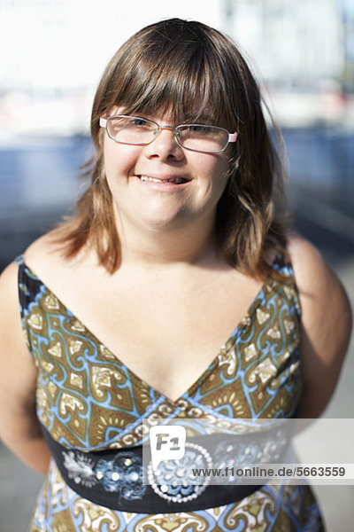 Portrait of a woman with down syndrome smiling