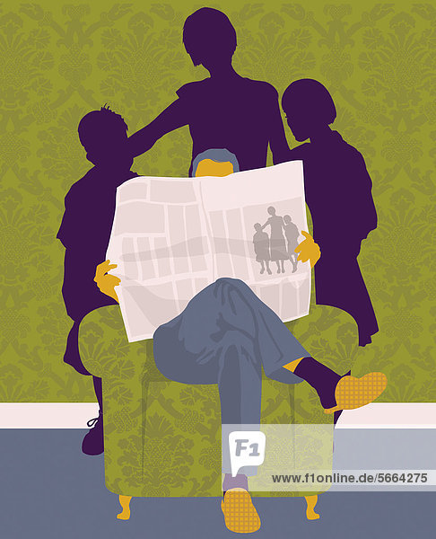 Family standing behind man reading newspaper in armchair