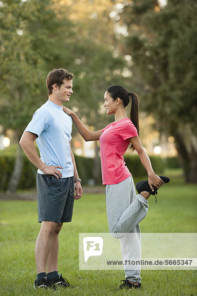 Young couple exercising outdoors
