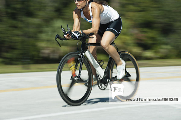 Woman riding road bike  cropped