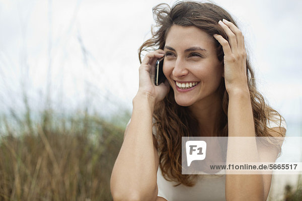 Young woman talking on cell phone  portrait