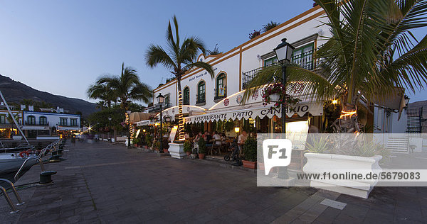 Restaurants and promenade at dusk at the harbour of Puerto de Mogan  Gran Canaria  Canary Islands  Europe  PublicGround