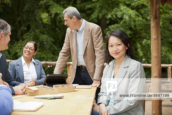 Businesswoman sitting at conference desk