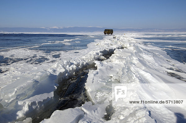 Car on frozen Lake Baikal  island Olkhon  Siberia  Russia  Eurasia